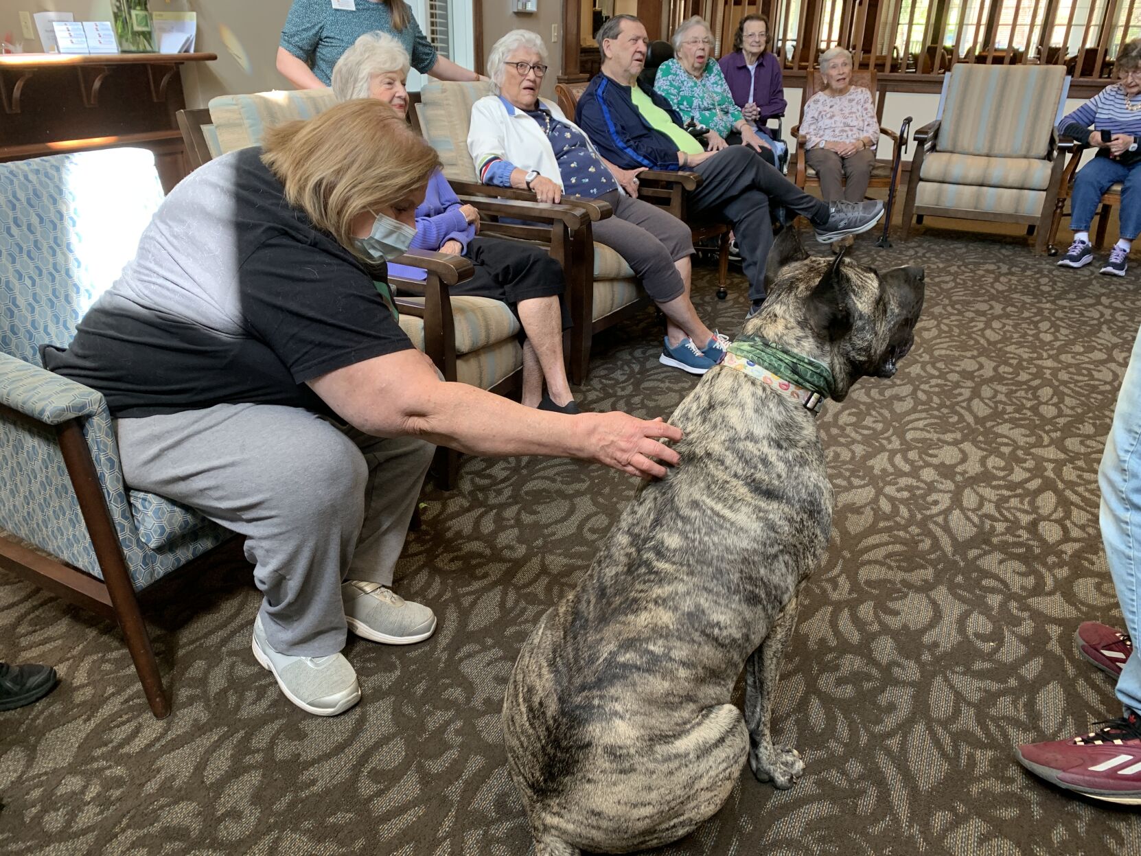 IMAGES: Ethan the dog visits residents at Louisville nursing home